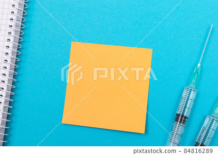 Vaccination or Revaccination Concept - Two Medical Syringe on Blue Table 84816289