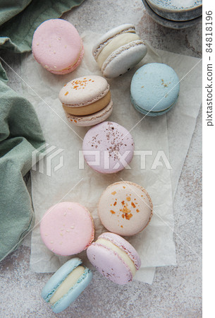 Beautiful colorful tasty macaroons on a concrete background Beautiful colorful tasty macaroons on a concrete background 84818196