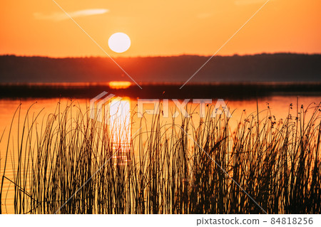 Sundown Above Lake River Horizon At Sunset. Natural Sky In Warm Colors Water. Sun Waters 84818256