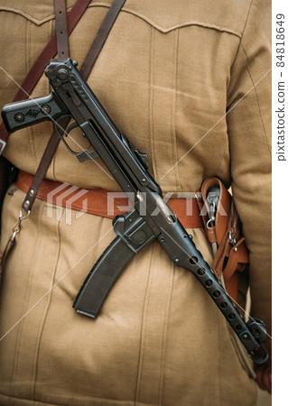 Re-enactor Dressed As Russian Soviet Infantry Soldier Of World War II With Sub-machine Gun Weapon. Red Army Soldier Of WWII WW2 Times Re-enactor Dressed As Russian Soviet Infantry Soldier Of World War II With Sub-machine Gun Weapon. Red Army Soldier Of WWII WW2 Times 84818649