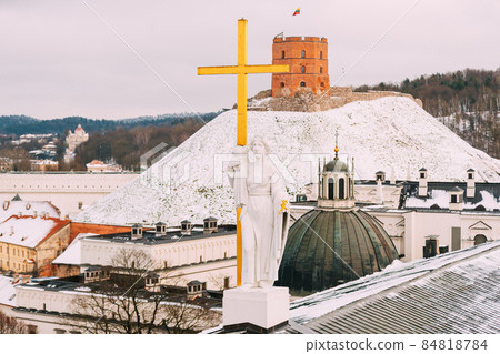 Vilnius Lithuania. Pediment Of Cathedral Basilica Of St. Stanislaus, St. Vladislav With Statues Of St. Elena And St. Stanislaus, Tower Of Gediminas Or Gedimino In Winter Day Vilnius Lithuania. Pediment Of Cathedral Basilica Of St. Stanislaus, St. Vladislav With Statues Of St. Elena And St. Stanislaus, Tower Of Gediminas Or Gedimino In Winter Day 84818784