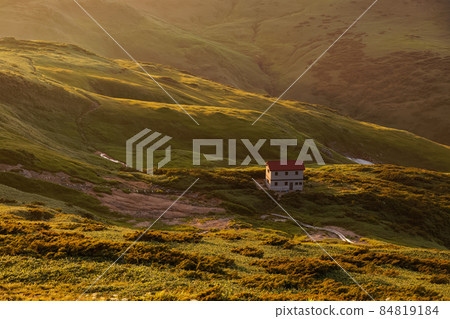 The fox hole hut at dusk seen from the Asahi mountain range and the three-way border The fox hole hut at dusk seen from the Asahi mountain range and the three-way border 84819184