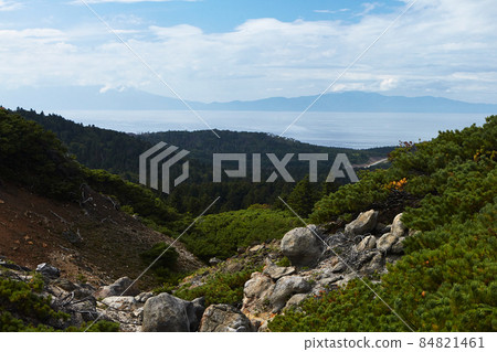 View from Volcano Mendeleev ( Rausu-dake in Japanese) with view of Japanese Island Hokkaido on horizon. View from Volcano Mendeleev ( Rausu-dake in Japanese) with view of Japanese Island Hokkaido on horizon. 84821461