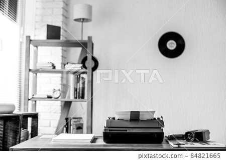Vintage old typewriter at wooden desk table Vintage old typewriter at wooden desk table 84821665