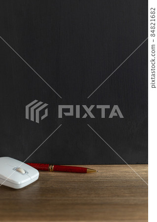Chalkboard and school supplies on table. Student home workplace Chalkboard and school supplies on table. Student home workplace 84821682
