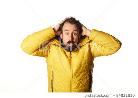 Hispanic Latin man surprised over white background isolated 84821830