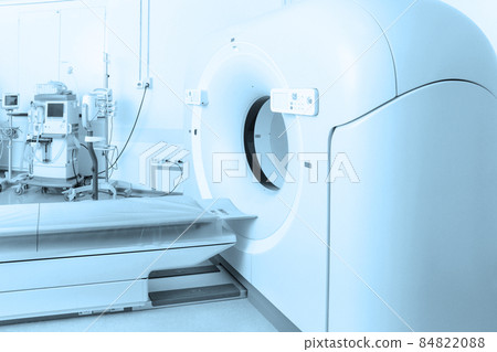 Medical CT or MRI Scan in the modern hospital laboratory. Interior of radiography department. Technologically advanced equipment in white room. Magnetic resonance diagnostics machine. Medical CT or MRI Scan in the modern hospital laboratory. Interior of radiography department. Technologically advanced equipment in white room. Magnetic resonance diagnostics machine. 84822088