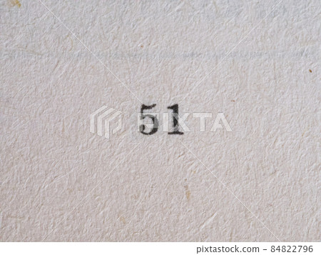 The number 51 printed on a piece of paper. Paper texture. The number 51 printed on a piece of paper. Paper texture. 84822796