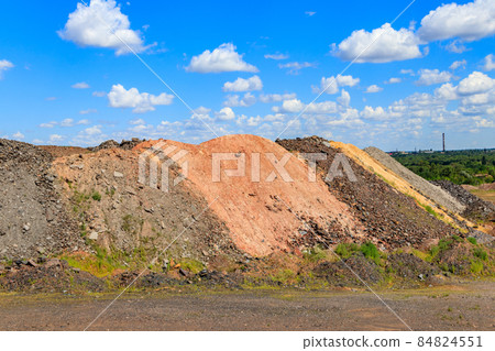 View of slag heaps of iron ore quarry. Mining industry View of slag heaps of iron ore quarry. Mining industry 84824551