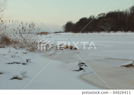 winter landscape lake is frozen covered with white snow 84826411