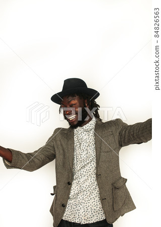 young handsome african american man gesturing emotional posing isolated on white background stylish hipster. youth concept young handsome african american man gesturing emotional posing isolated on white background stylish hipster. youth concept 84826563