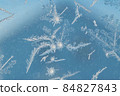 Snowflakes on a window 84827843