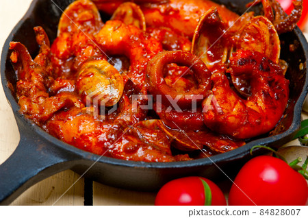 fresh seafoos stew on an iron skillet fresh seafoos stew on an iron skillet 84828007