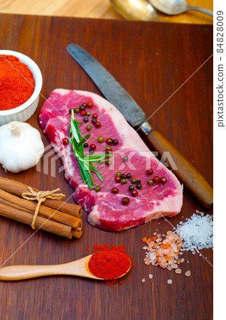 raw uncooked  ribeye beef steak butcher selection 84828009