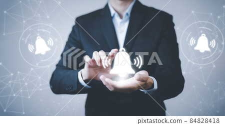 Businessman touch finger to press the button. Notification bell button on smartphone app screen close up,App Notification on Smart Phone Screen, Remote online alerts, home security signal. Businessman touch finger to press the button. Notification bell button on smartphone app screen close up,App Notification on Smart Phone Screen, Remote online alerts, home security signal. 84828418