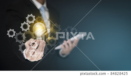 Concept creativity with light bulbs and energy power,Businessman hand holding light bulb and gear web engineering to success on metal texture background, technology and innovation concept, 84828425