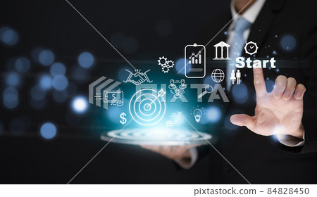 New Targeting the icon business and human concept, Businessman holding virtual target dart board and touch Start word ,Executive marketing, investment goal and target for business investment concept. 84828450