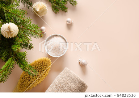Relax and wellness before Christmas holiday. Cosmetic sea salt, wellness objects. 84828536