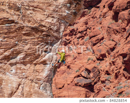 People doing rock climbing sports People doing rock climbing sports 84828854