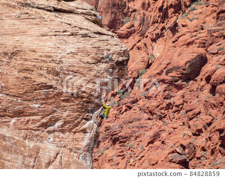 People doing rock climbing sports People doing rock climbing sports 84828859