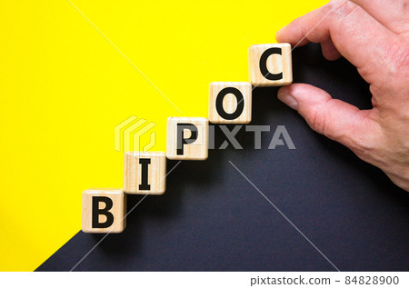 BIPOC symbol. Abbreviation BIPOC, black, indigenous and people of color on wooden cubes. Beautiful yellow background. Copy space. Business and BIPOC, black, indigenous and people of color concept. BIPOC symbol. Abbreviation BIPOC, black, indigenous and people of color on wooden cubes. Beautiful yellow background. Copy space. Business and BIPOC, black, indigenous and people of color concept. 84828900