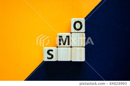 SMO, social media optimization symbol. Wooden cubes with word 'SMO - social media optimization' on beautiful yellow background, copy space. Business, SMO - social media optimization concept. SMO, social media optimization symbol. Wooden cubes with word 'SMO - social media optimization' on beautiful yellow background, copy space. Business, SMO - social media optimization concept. 84828993