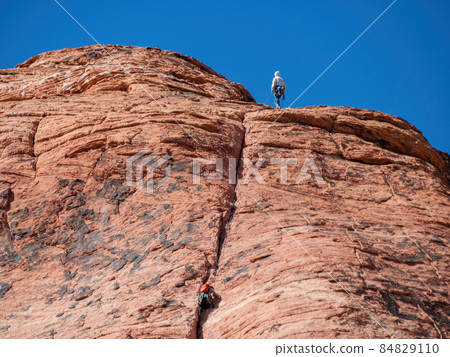 People doing rock climbing sports 84829110