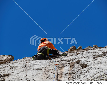 People doing rock climbing sports People doing rock climbing sports 84829223