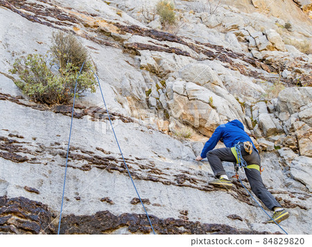 People doing rock climbing sports 84829820