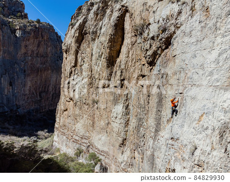 People doing rock climbing sports People doing rock climbing sports 84829930
