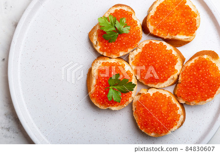 Sandwiches with red caviar top view copy space Sandwiches with red caviar top view copy space 84830607