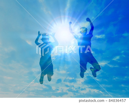 Two men and women jumping silhouette_blue sky background Two men and women jumping silhouette_blue sky background 84836457