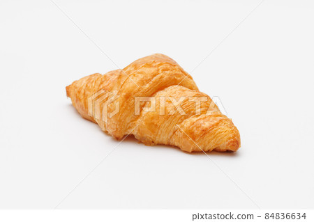 Freshly baked croissants in tan on a white background 84836634