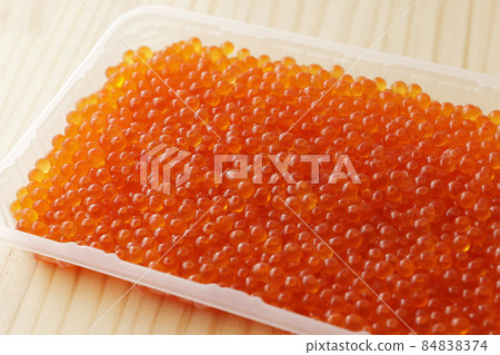 Salmon roe pickled in soy sauce in a pack container 84838374