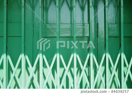 Horizontal traditional retro Hong Kong style green shop front building metal gate rolling door design 84839257