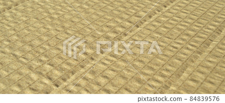Brown and beige colored corrugated cardboard detail 84839576