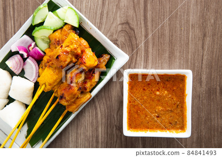 Malaysian chicken satay with delicious peanut sauce. 84841493