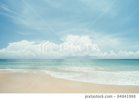Beautiful tropical beach with blue sky and white clouds abstract texture background. Copy space of summer vacation and holiday business travel concept. Beautiful tropical beach with blue sky and white clouds abstract texture background. Copy space of summer vacation and holiday business travel concept. 84841998