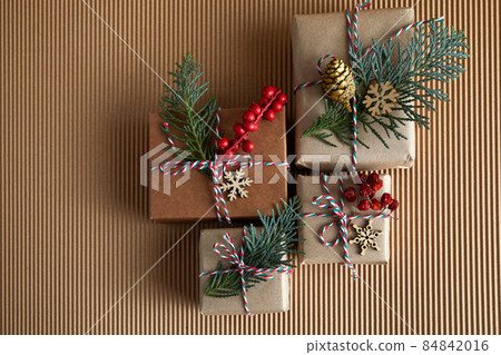 Flat lay composition with Christmas gifts biege background. Boxing day Flat lay composition with Christmas gifts biege background. Boxing day 84842016