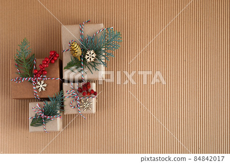 Flat lay composition with Christmas gifts biege background. Boxing day Flat lay composition with Christmas gifts biege background. Boxing day 84842017