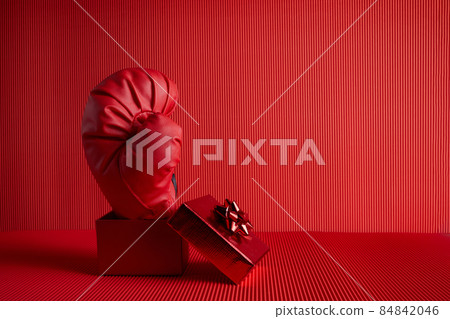 Boxing day shopping creative idea. Boxing glove coming out of gift box. Boxing day shopping creative idea. Boxing glove coming out of gift box. 84842046