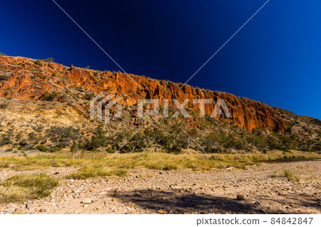 Rocky mountains on the cliffs of Glen Helen Gorge in the Northern Territory, Australia 84842847
