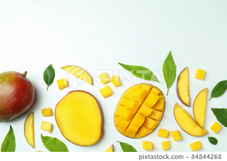 Ripe mango fruits on white background, top view Ripe mango fruits on white background, top view 84844268