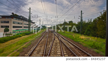 Point of view train travel under cloudy sky Point of view train travel under cloudy sky 84845237
