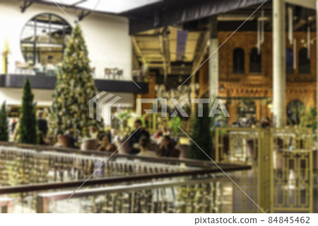 coffee shop blur background with bokeh and working man in a cafe 84845462