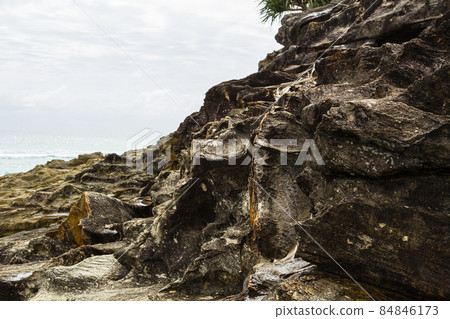 Rocks on Cylinder Beach on North Stradbroke Island, Australia Rocks on Cylinder Beach on North Stradbroke Island, Australia 84846173