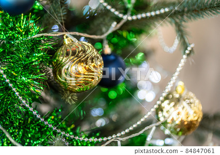 Merry x-mas,Close up of Colorful balls ,gifts box and Christmas greeting picture parcel decoration on Green Christmas tree background Decoration During Christmas and New Year. 84847061