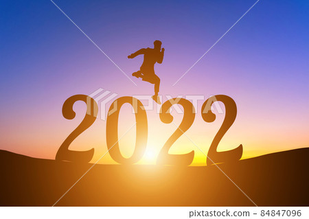 Happy New Year Numbers 2022, Silhouette a man handsome jumping feels happy moving early morning sunrise over the horizon background, Health and Happy new year concept. Happy New Year Numbers 2022, Silhouette a man handsome jumping feels happy moving early morning sunrise over the horizon background, Health and Happy new year concept. 84847096