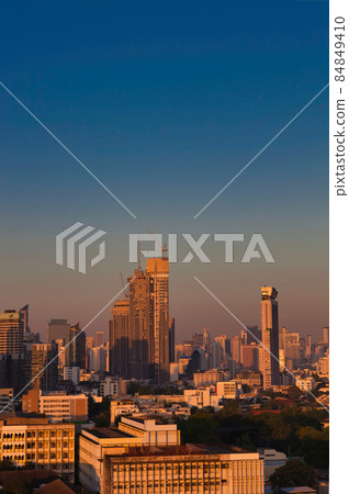 Awakening of the city Buildings in the sunrise Awakening of the city Buildings in the sunrise 84849410