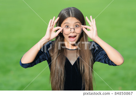 Adorable small child with surprised look and open  84850867